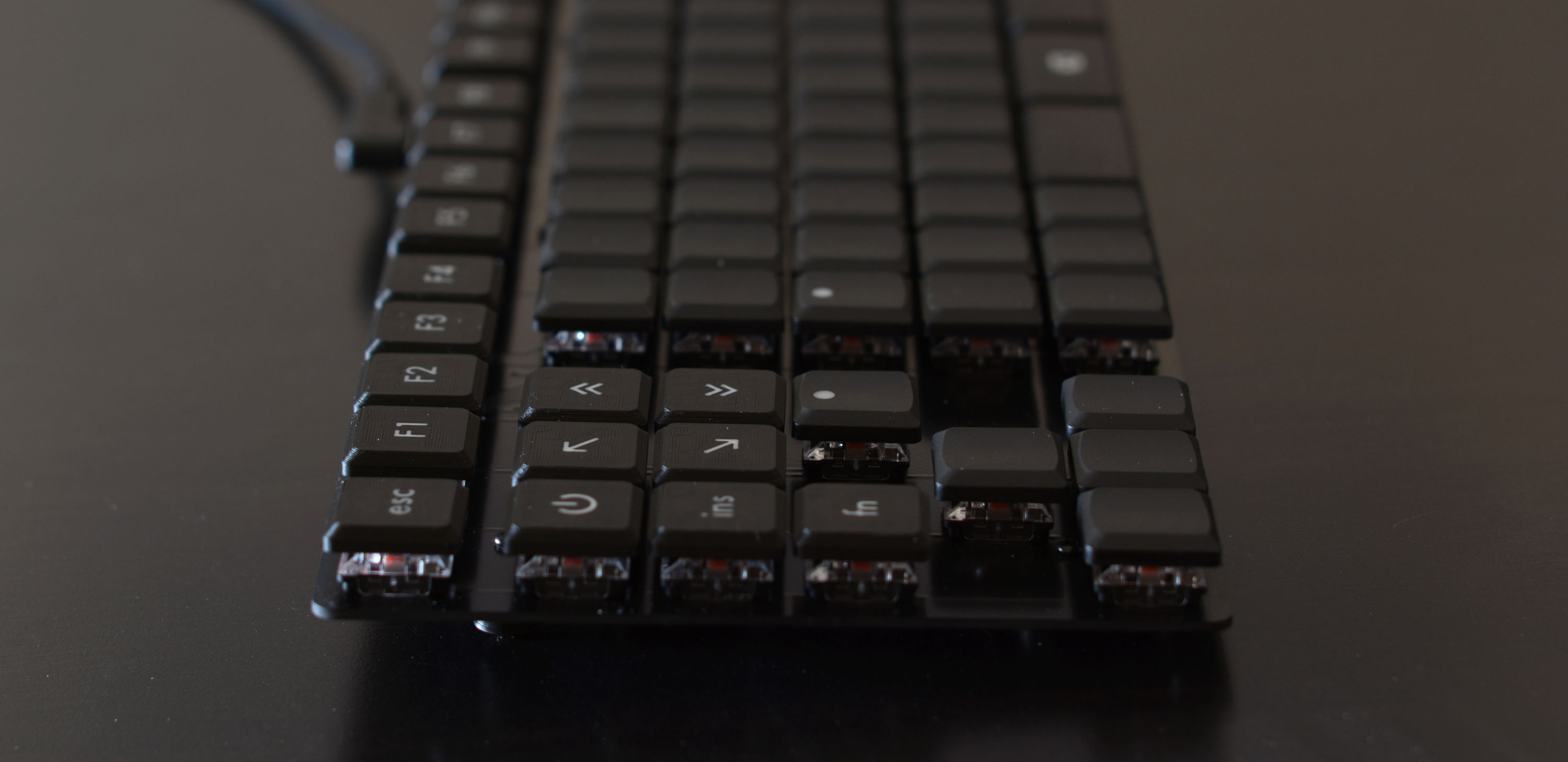low-key photo of keyboard with narrow depth of field